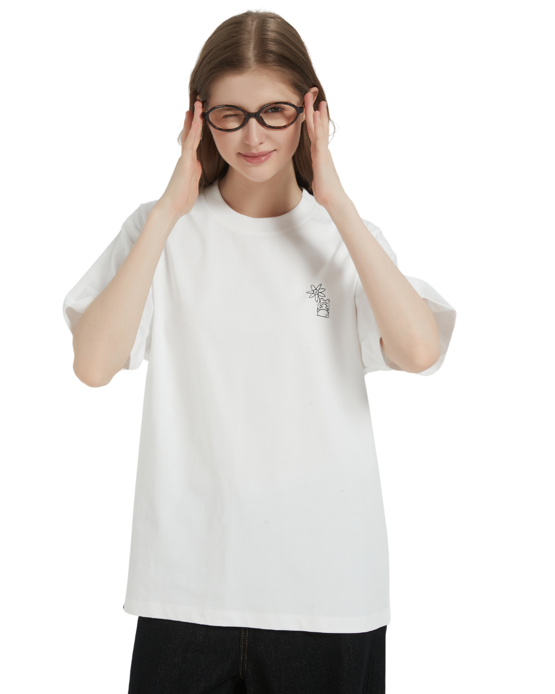 Person wearing a white t-shirt with a small design on a plain background