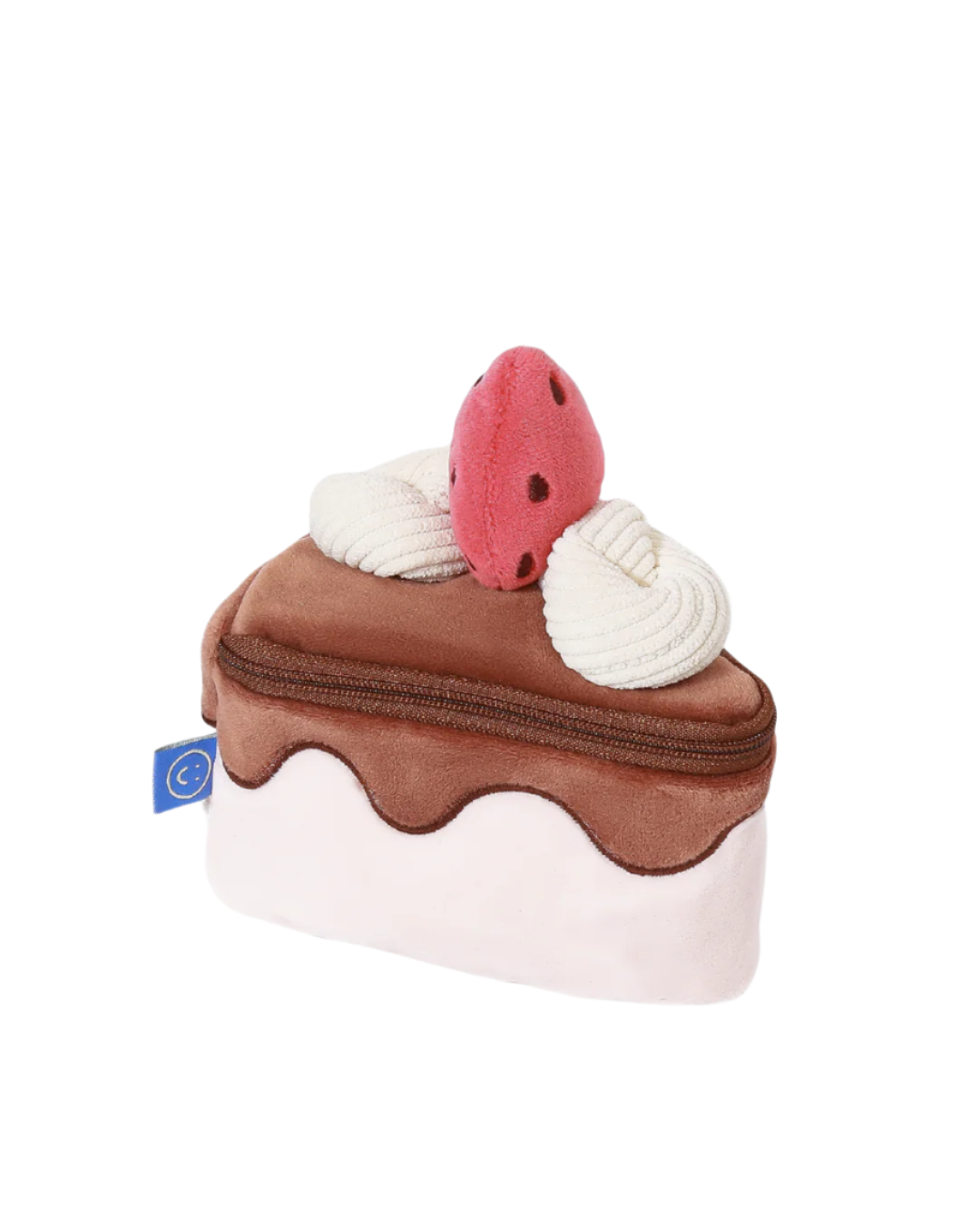 Toy resembling a slice of cake with a cherry on top on a white background