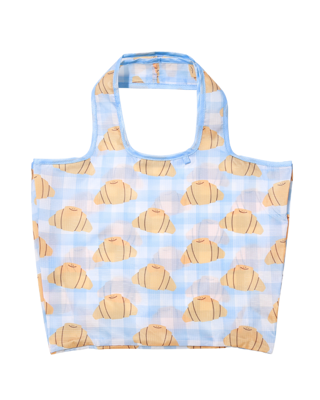 Front View of the large reusable bag with cute smiling croissant prints