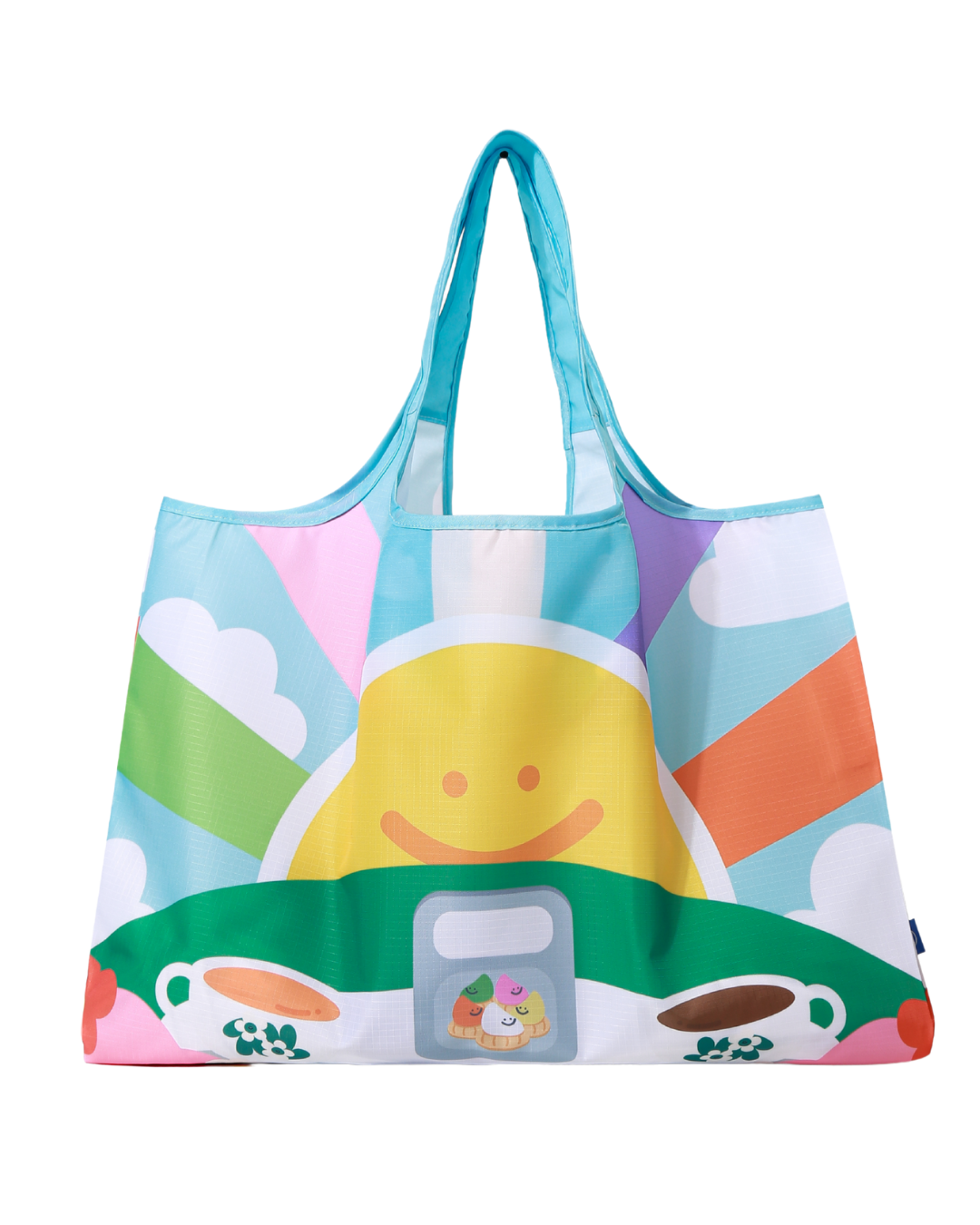 A shopper reusable bag with an artwork of a cup of coffee and tea with a large bright smiley sunshine