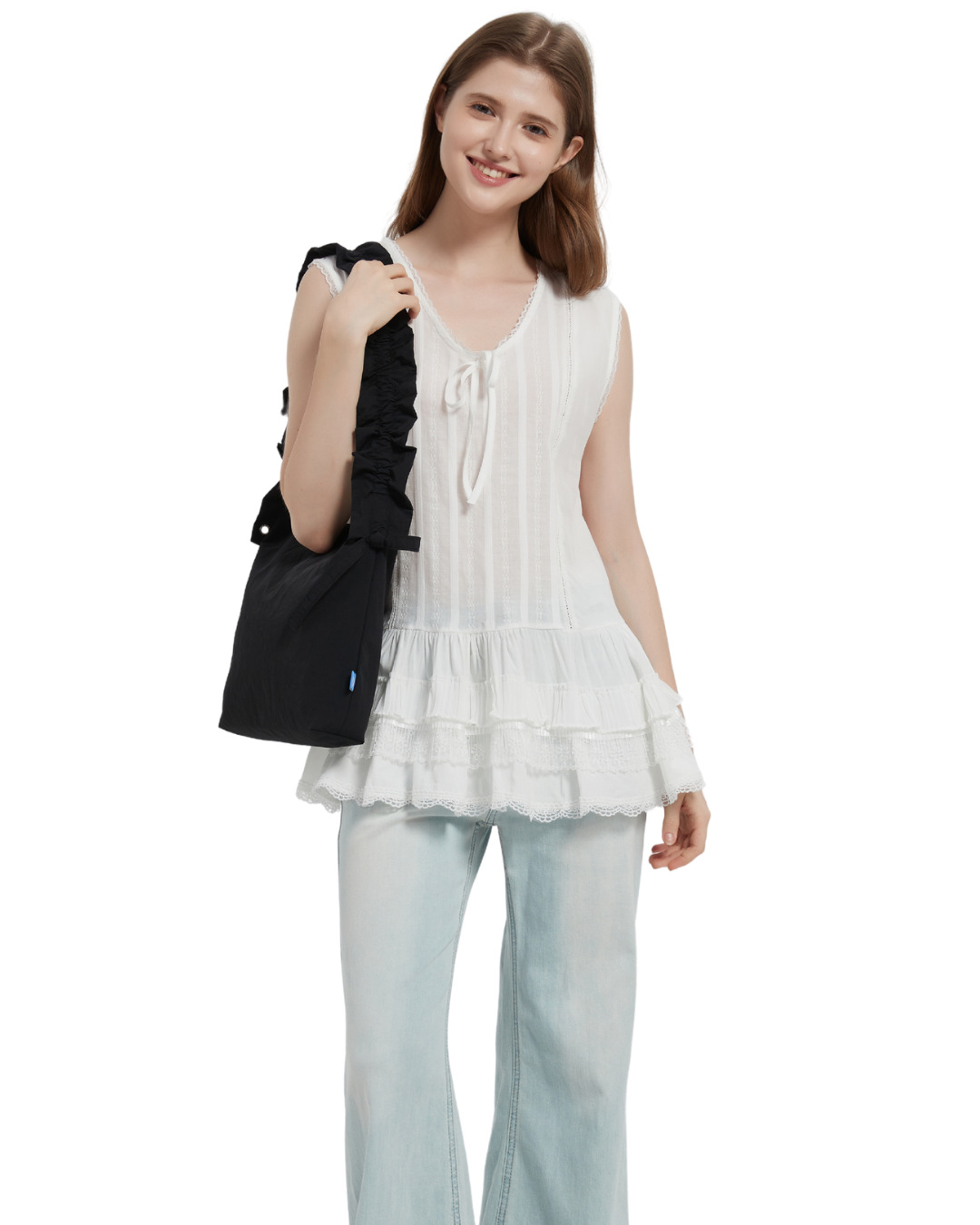 the petal bag in black sling shoulder carried by a model