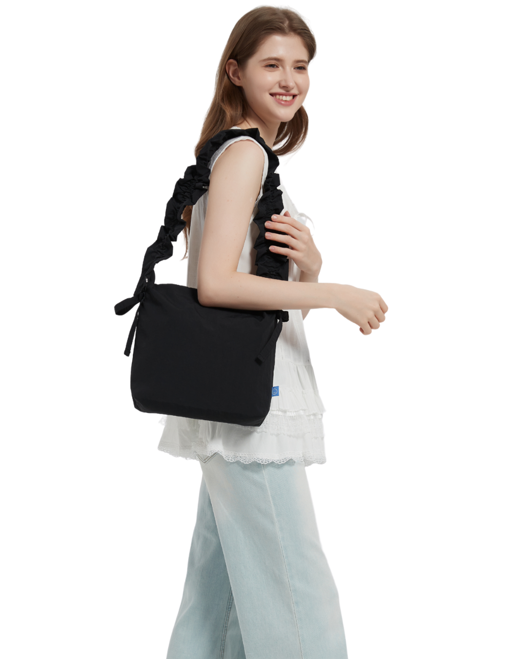 the petal bag in black shoulder carried by a model