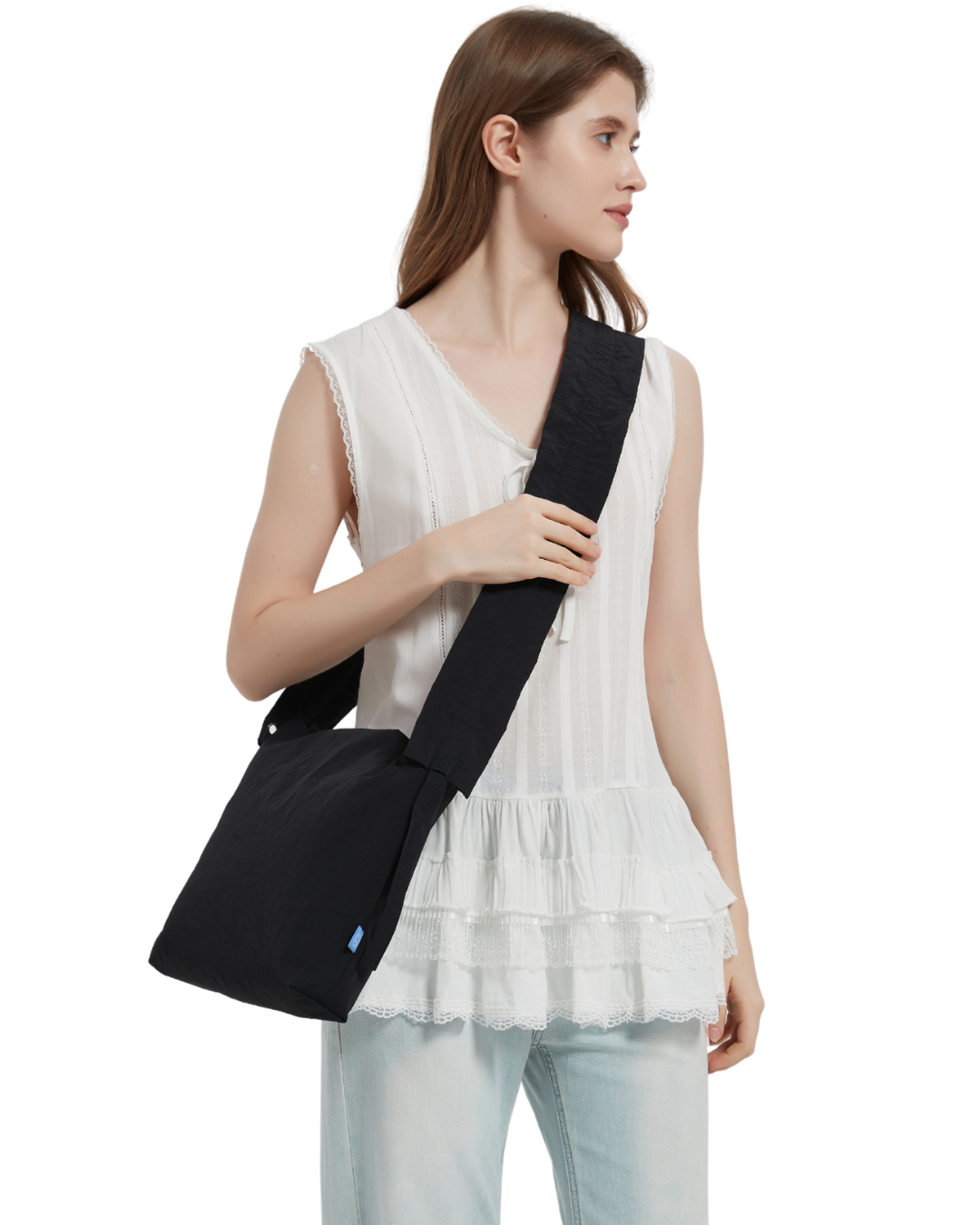 the petal bag in black sling carried by a model