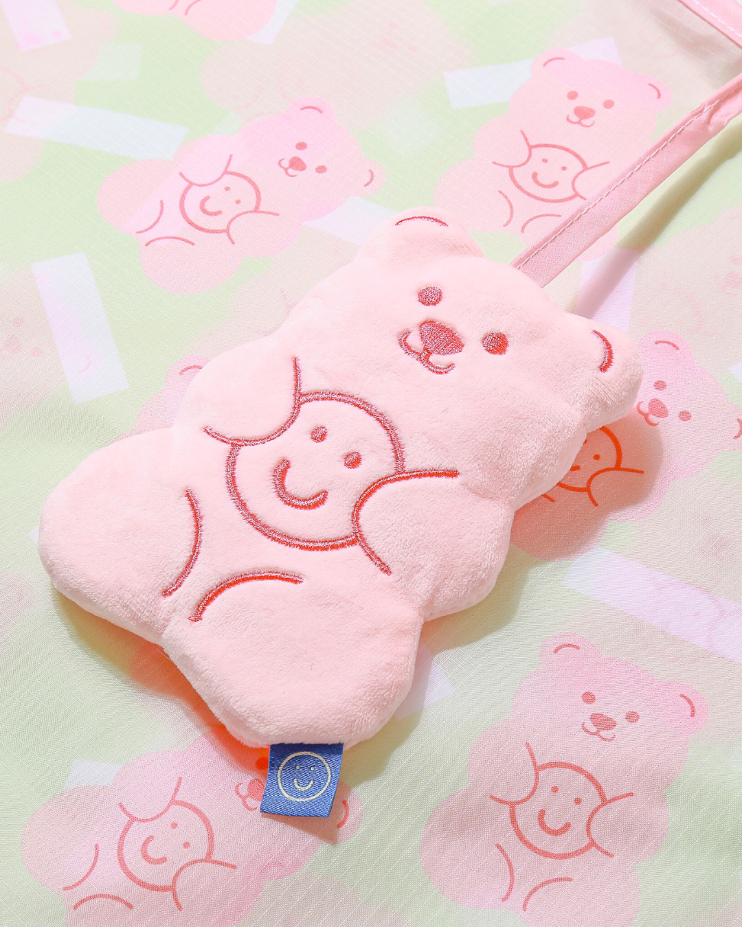 close up view of the gummy bear plushie on the reusable bag