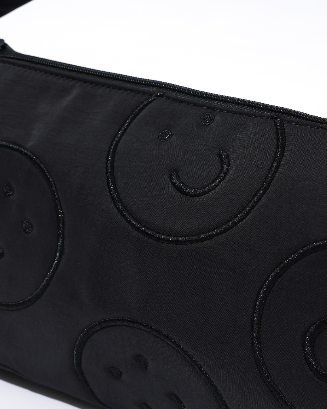 Signature Smile Embroidery Bolster Bag in Black