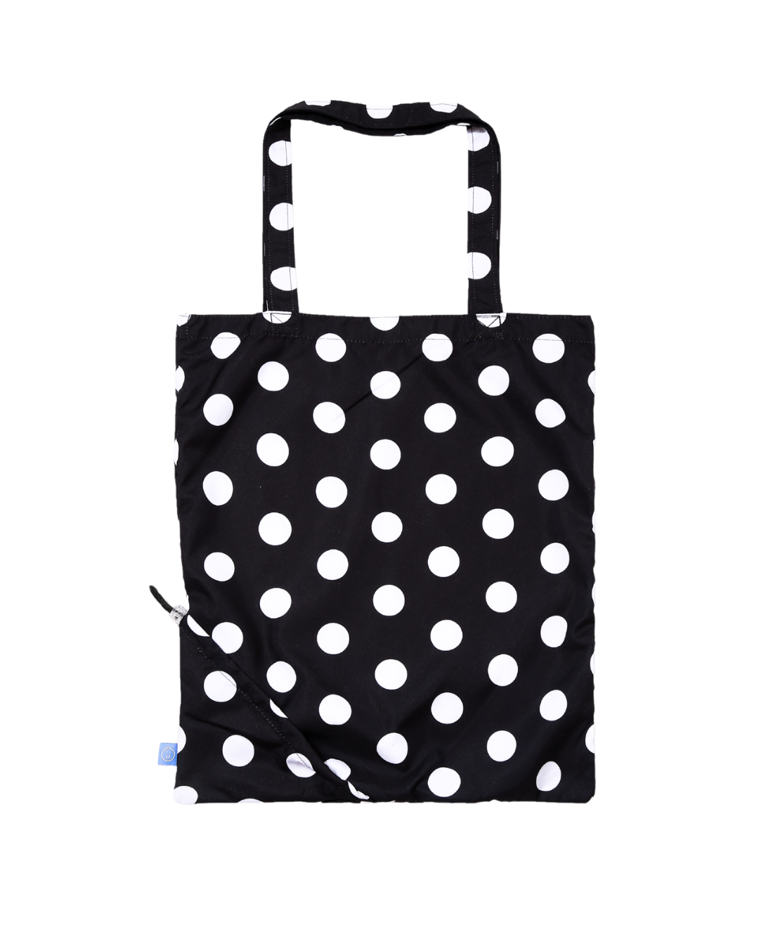 Black tote bag with white polka dots on a white background