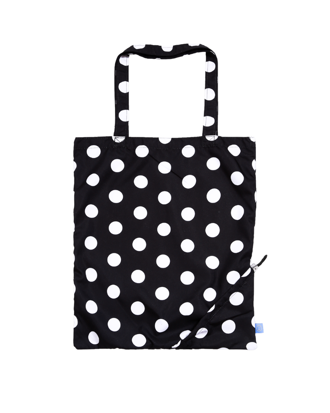 Black tote bag with white polka dots on a white background