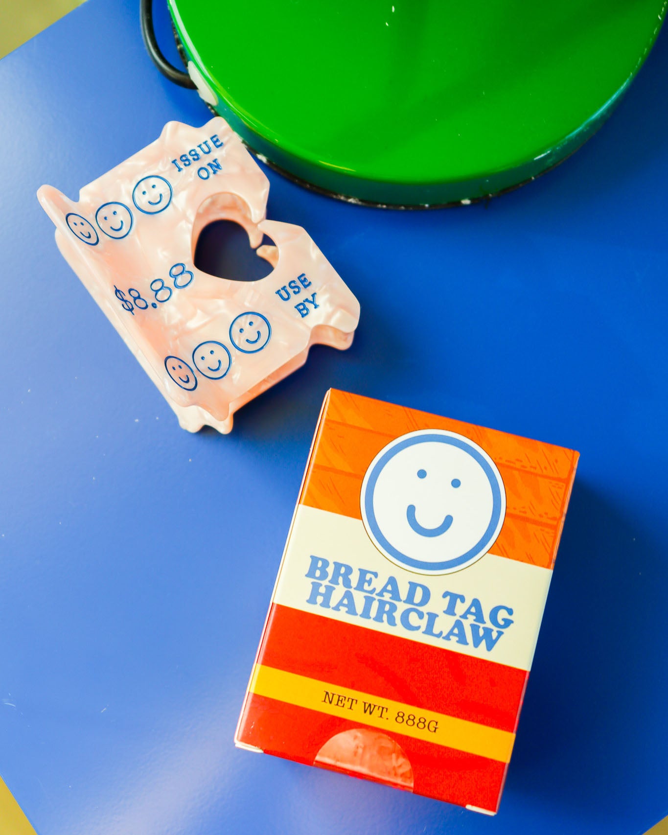 hair claw in a shape of a bread tag with smiley faces