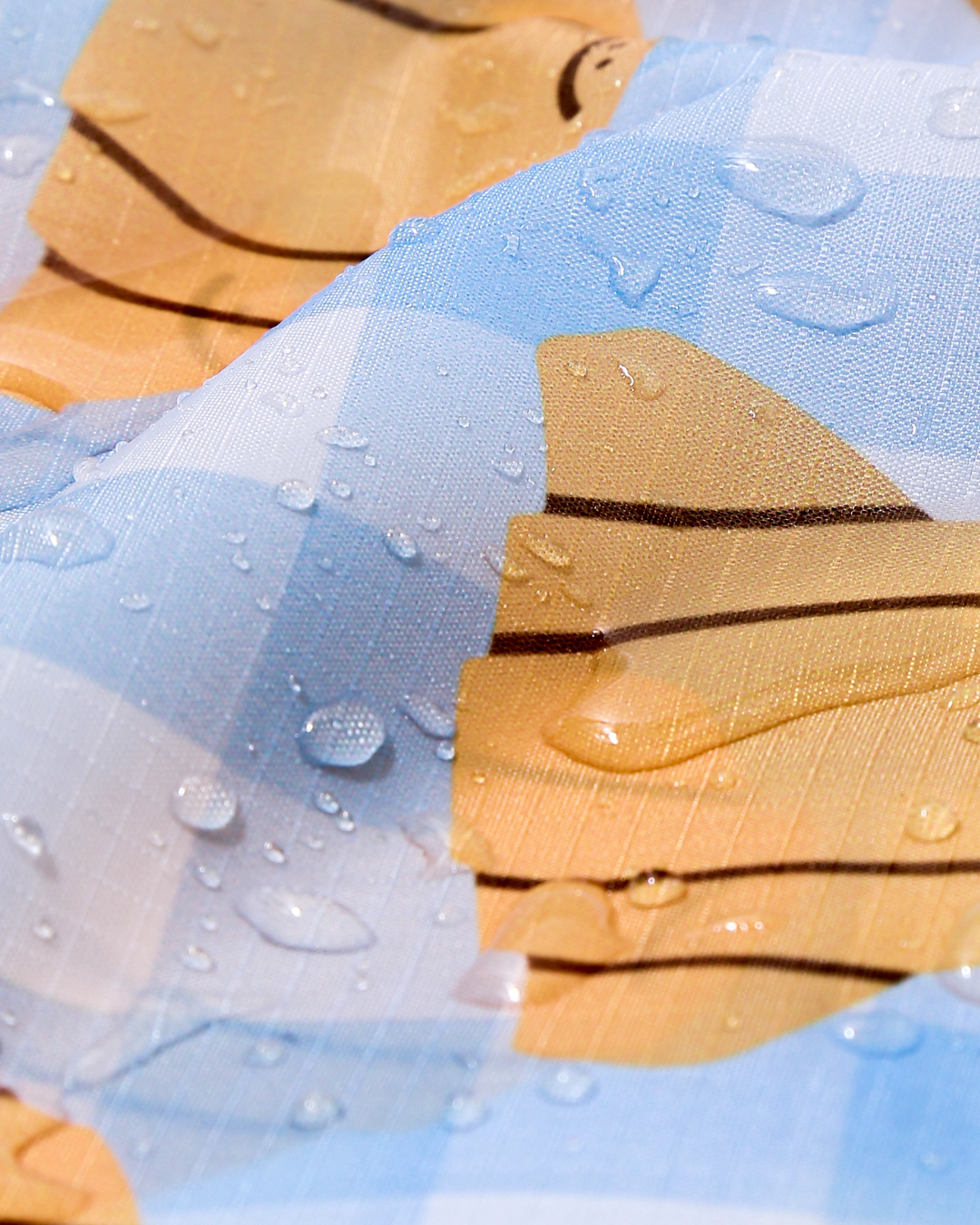 close up view of the waterproof material with water droplets