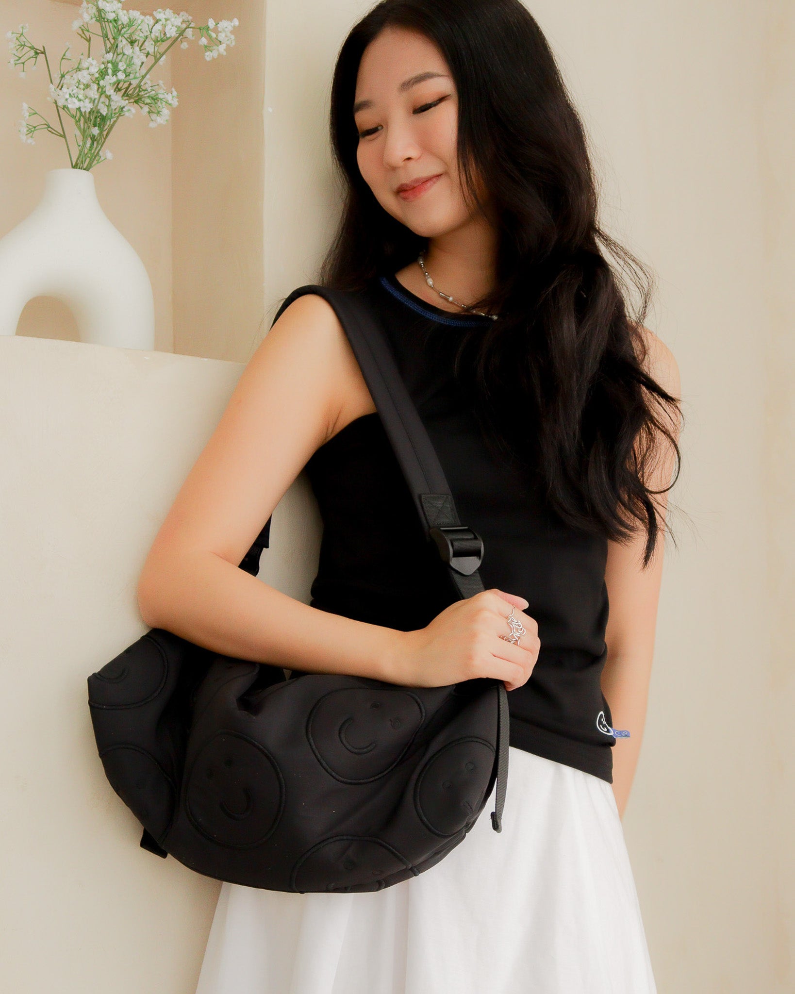 Signature Smile Embroidery Bolster Bag in Black