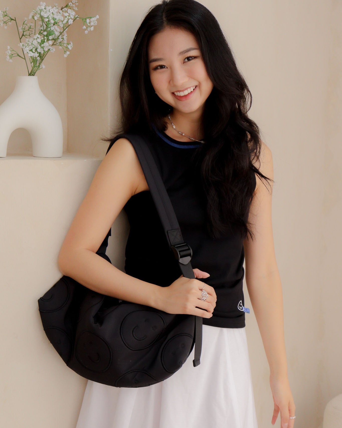 Signature Smile Embroidery Bolster Bag in Black