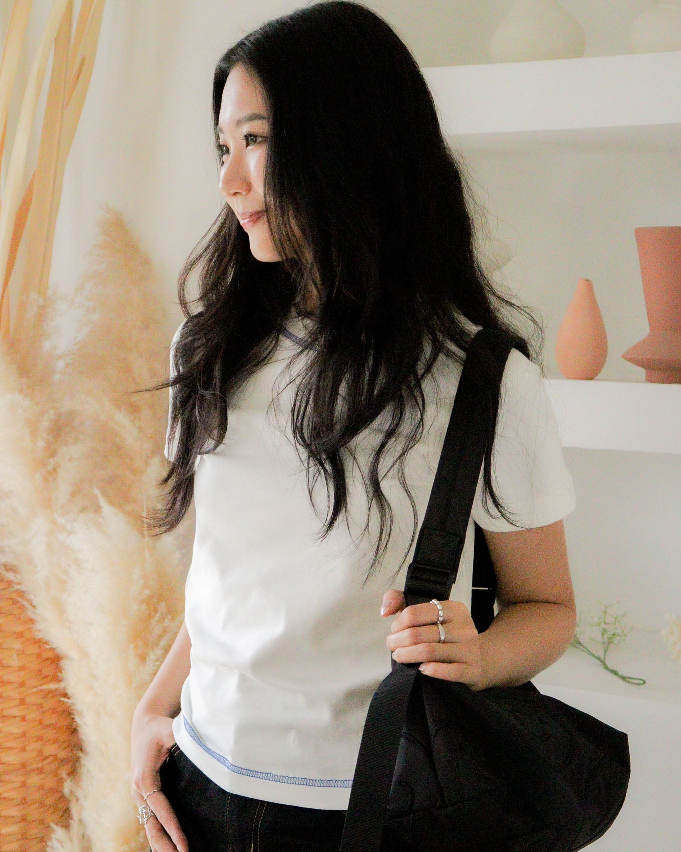 Signature Smile Embroidery Bolster Bag in Black