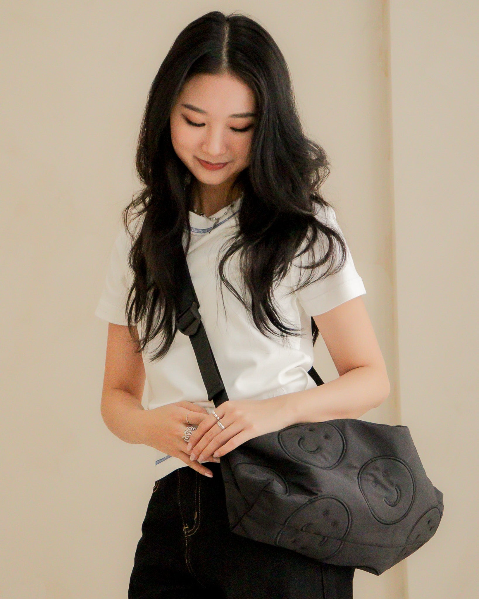 Signature Smile Embroidery Bolster Bag in Black