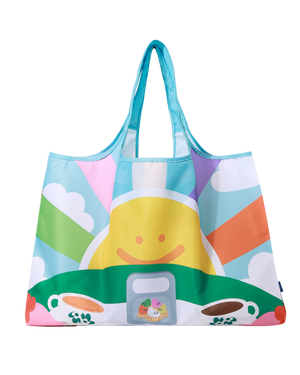 A shopper reusable bag with an artwork of a cup of coffee and tea with a large bright smiley sunshine