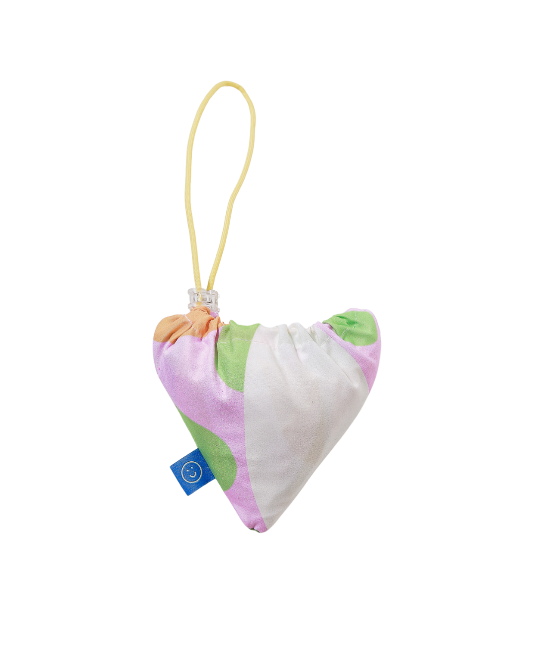 Folded reusable bag with a smiley face tag on a white background