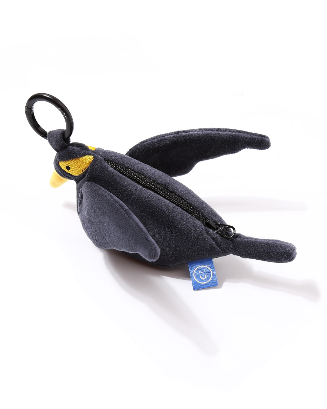 Black mynah bird exterior pouch with a zipper pull with reusable bag within on a white background