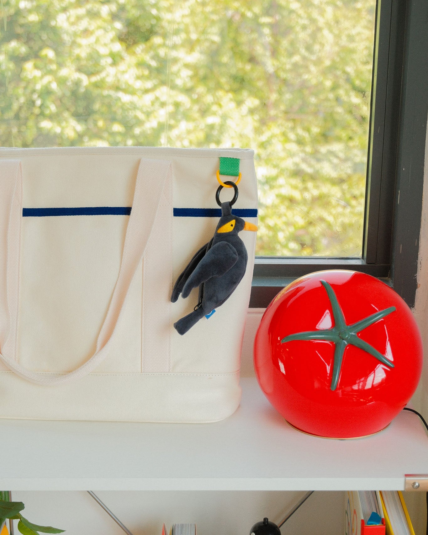 Mynah bird plushie reusable bag hung on a bag 