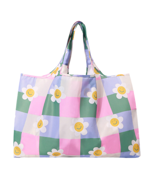 A shopper reusable bag with checkered prints of a flower in pastel shade