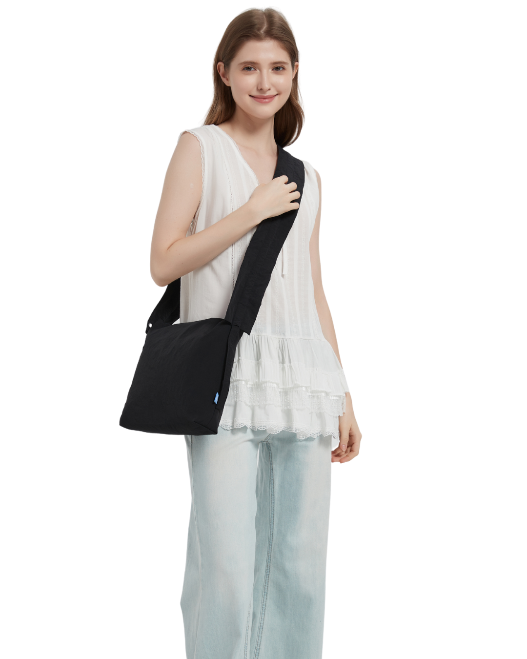 the petal bag in black sling carried by a model
