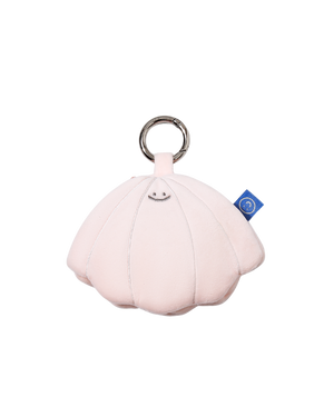 cute beige, pink seashell plushie smiling