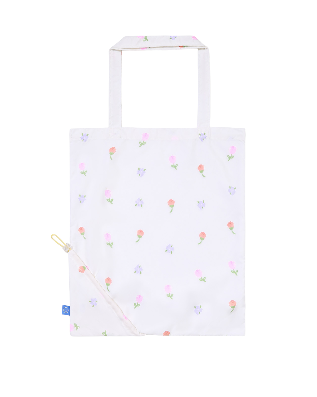 White tote bag with colorful floral pattern on a white background