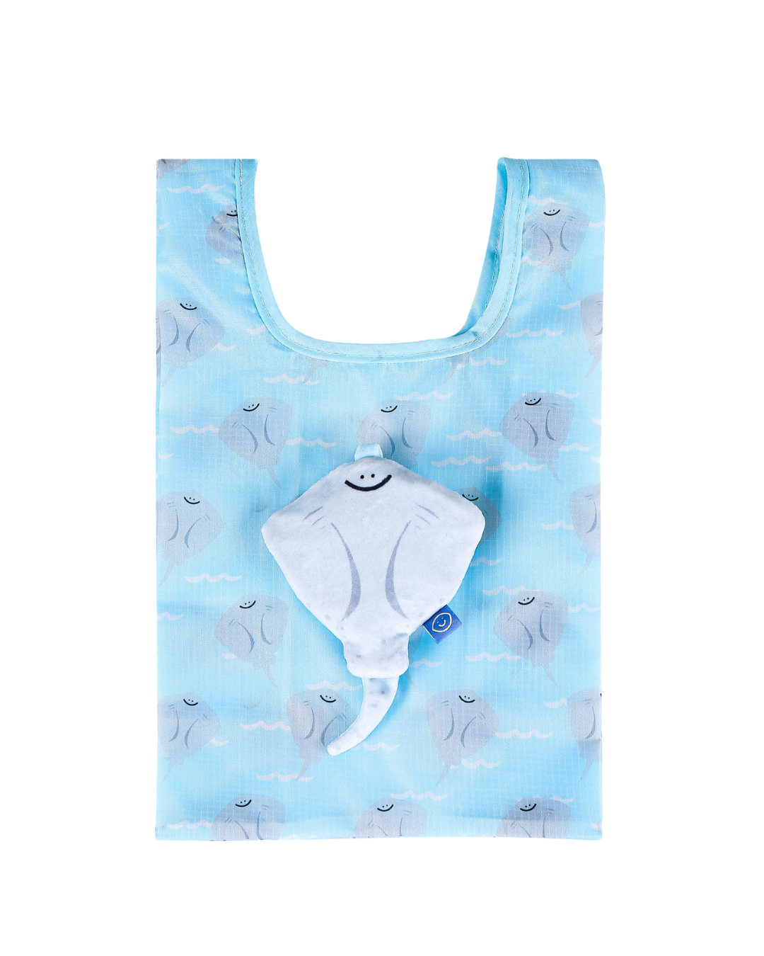 A cute stingray plushie on top of the inner printed reusable bag