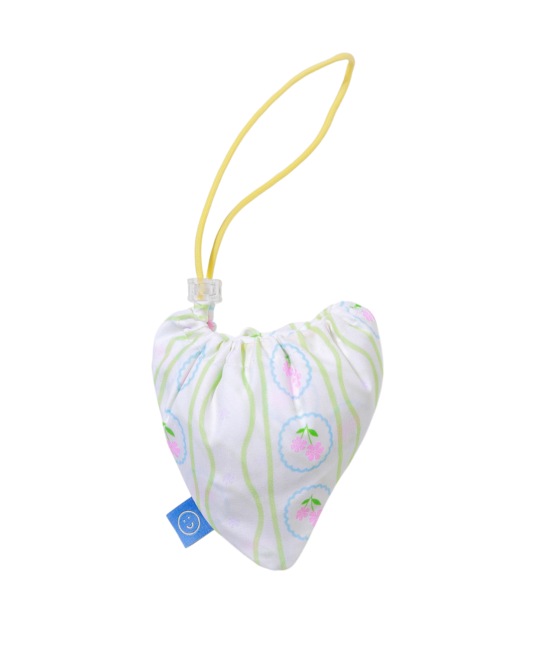 Stashed tote bag into a heart-shaped pouch with a yellow strap on a white background