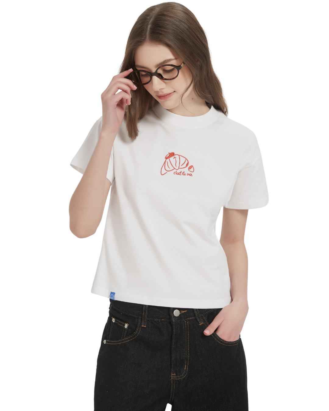 front view of the cest la vie baby tee in white on the model