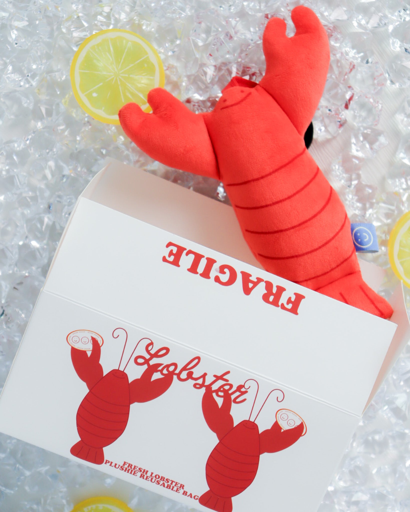 cute lobster plushies on fake ice