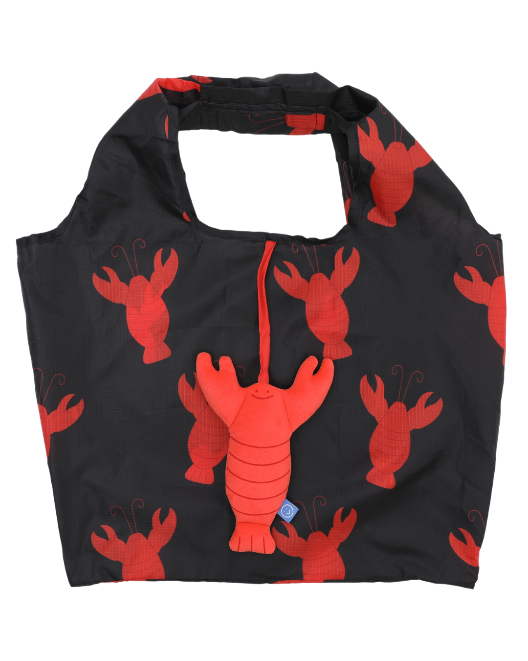 A studio photo of the lobster plushie with the reusable bag