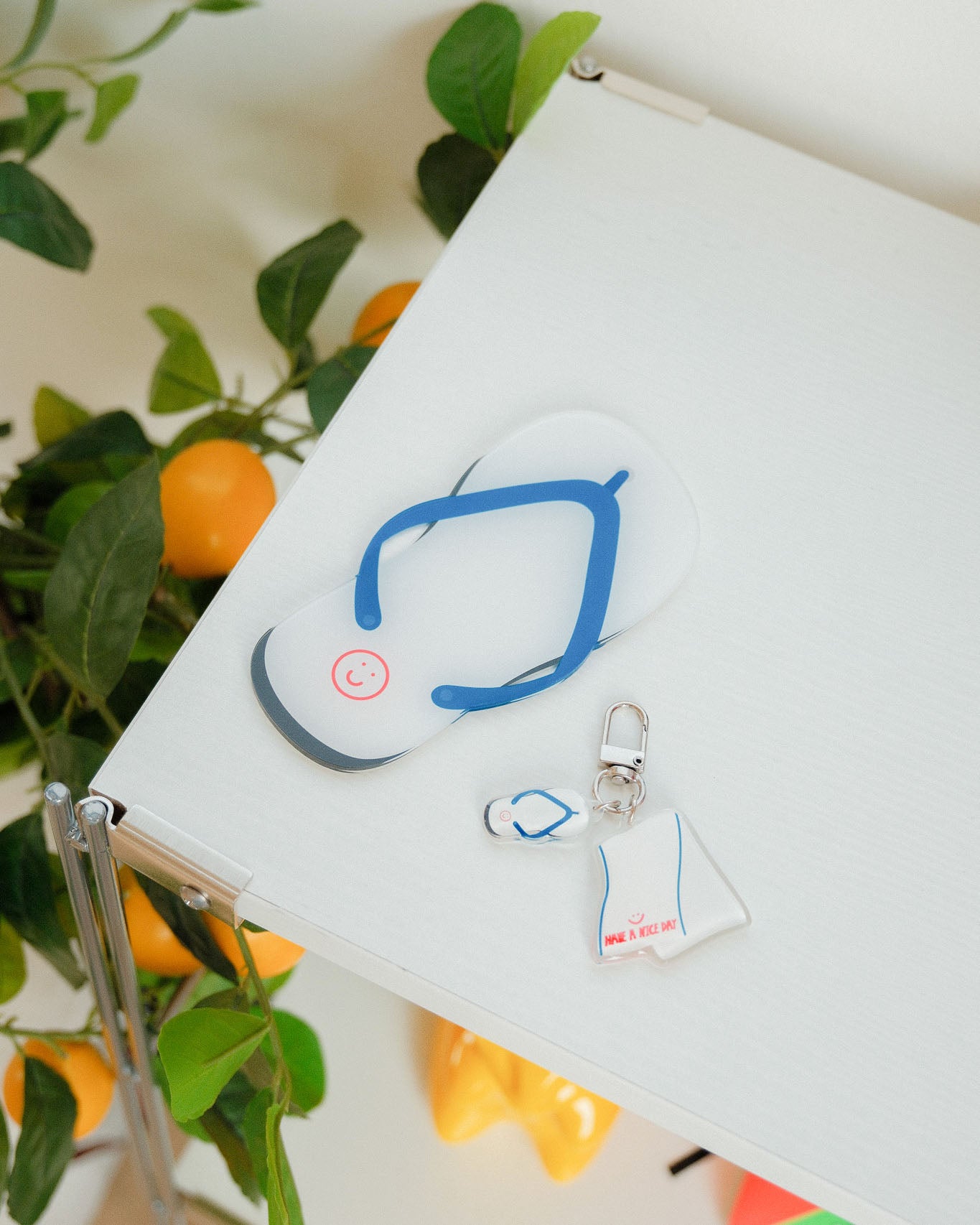 slipper coaster and keychain on a table